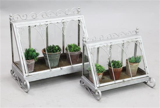 Two silver painted wrought iron terrariums, largest-W 1ft 10in. D. 1ft 2in. H. 1ft 7in.